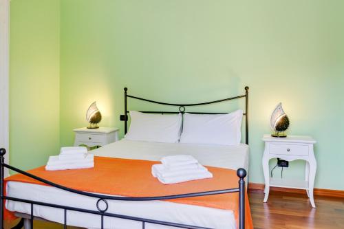 Giường trong phòng chung tại Arquà Petrarca Vista sui colli - Giardino & garage