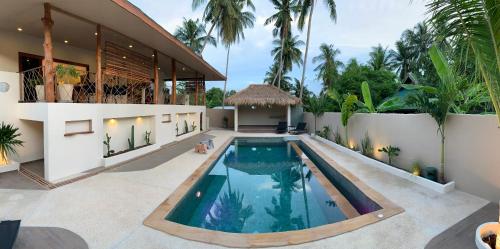 an image of a house with a swimming pool at Baan Taolili villa 3 bedrooms in Hinkong