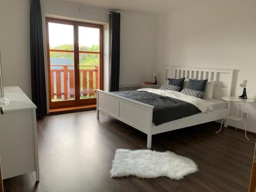 Ein Bett oder Betten in einem Zimmer der Unterkunft Apartmány stare-hory Krkonoše