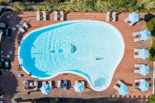 an overhead view of a swimming pool at a resort at Hotel La Funtana in Santa Teresa Gallura