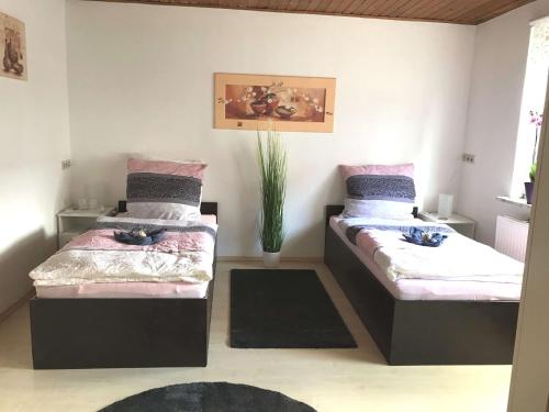 Ein Bett oder Betten in einem Zimmer der Unterkunft Haus der Auszeit 180 qm FeWo inklusive Sauna