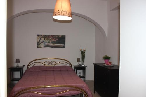 Casa Vacanze Nonna Raffa tesisinde bir odada yatak veya yataklar