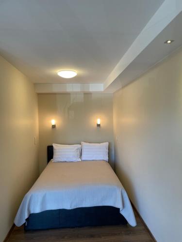 Postel nebo postele na pokoji v ubytování Apartamentai Daukanto 10