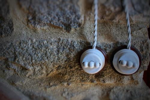 a pair of headphones hanging on a wall at B&B Melograno in Triei