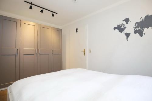 Ein Bett oder Betten in einem Zimmer der Unterkunft Papillon Wohnung 18-3