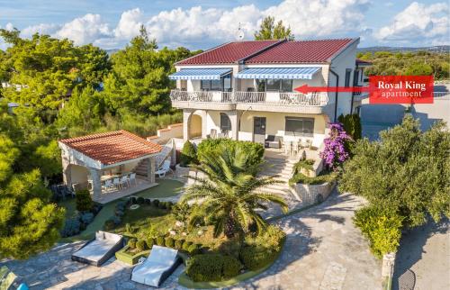 an aerial view of a house with a red sign at Apartments Villa Punta Royal in Pirovac