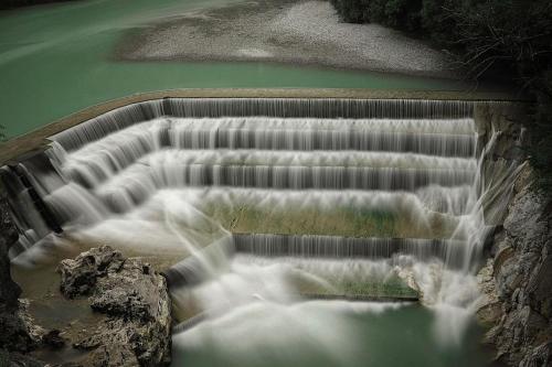 an aerial view of a waterfall in a river at Hotel Fürstenhof in Füssen