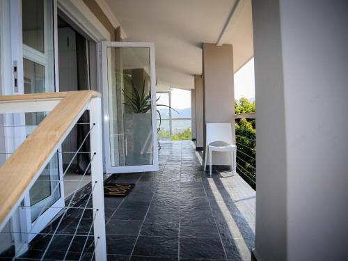 a hallway of a house with a glass door at Mogi Boutique Hotel in Ezulwini