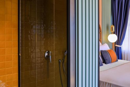 a shower in a room with a bed at Luff Boutique Hotel - Adult Only in Kas