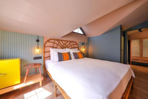 a bedroom with a large white bed and a window at Luff Boutique Hotel - Adult Only in Kas