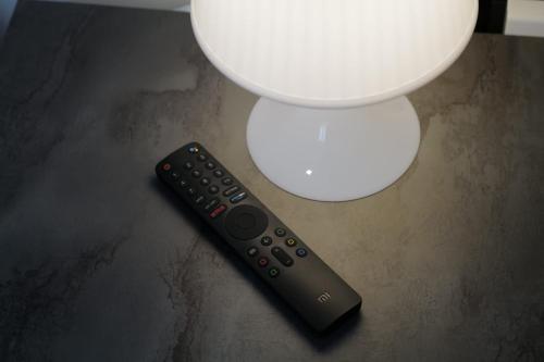 a remote control sitting on a table next to a toilet at Albergo 3 Torri in Maddaloni
