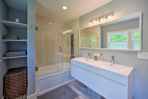 a bathroom with a sink and a shower and a tub at Charming Cottage with Deck Mtn and Lake Views! in Wallkill