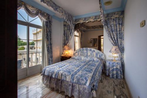 Postel nebo postele na pokoji v ubytování Hotel Hidalgo