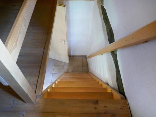 a staircase in a house with wooden floors at Holiday Home Rustico Dolomia by Interhome in Acquacalda