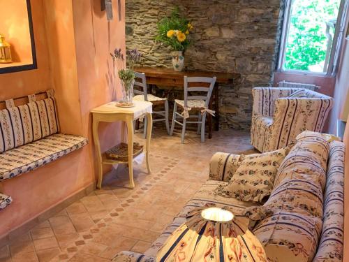 a living room with a couch and a table at Holiday Home Arietta VLO150 by Interhome in Valloria
