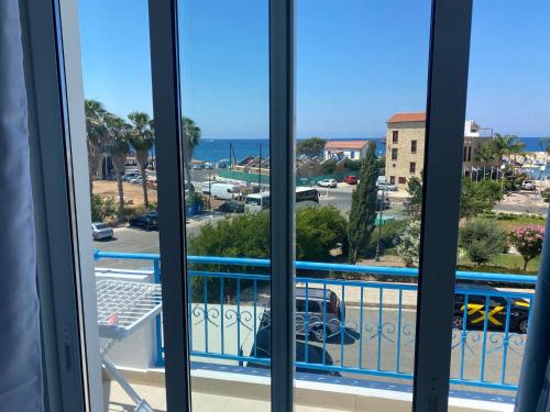 a view from a balcony with a view of the ocean at Blue Lagoon Latsi Centre in Lachi