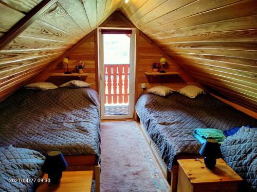 A bed or beds in a room at Kuligowka Szklarska Poreba