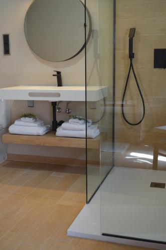 a bathroom with a shower and a sink at CAL MILIO in Mayals
