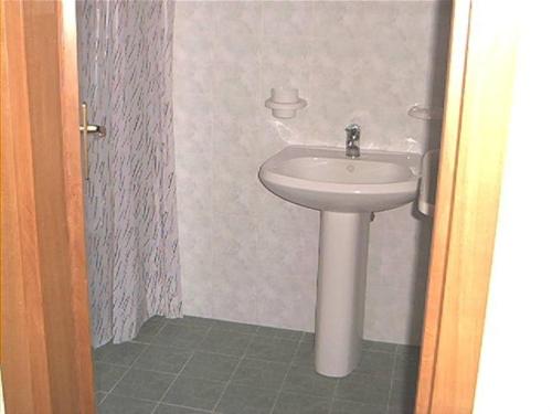 a bathroom with a white sink and a toilet at L'Isolana Case Vacanza Luna 1 in Ponza