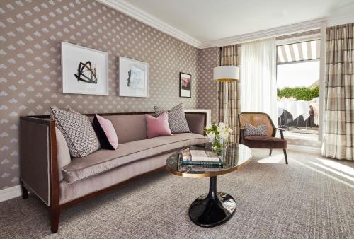 a living room with a couch and a table at The Westbury Hotel in Dublin
