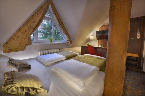 Postel nebo postele na pokoji v ubytování Maxmilian Lifestyle Resort