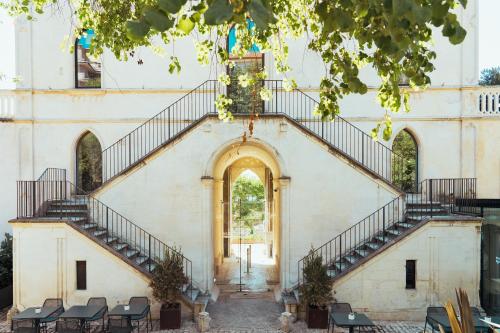 an entrance to a church with stairs at Villa Boscarino Boutique Hotel & Spa in Ragusa