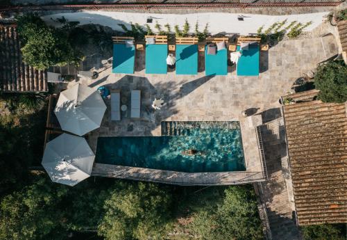 an overhead view of a swimming pool with blue water at Mas Saint Laurent in Les Salles-du-Gardon