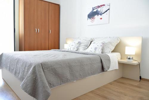 Posteľ alebo postele v izbe v ubytovaní Villy City Apartment