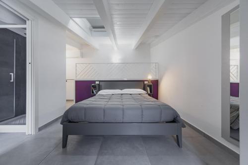 מיטה או מיטות בחדר ב-Affittacamere Giglio di mare