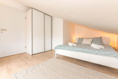 a bedroom with a bed in a room with an attic at Apartment Egon in Malinska