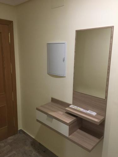 a bathroom with a large mirror on the wall at RUIDERA HOLIDAY in Ruidera