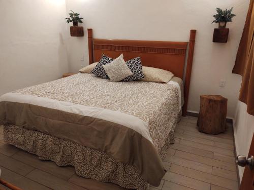 Tempat tidur dalam kamar di Casa Gekos Cuijas