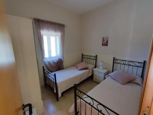 Posteľ alebo postele v izbe v ubytovaní Villa Rosy