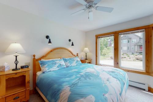 A bed or beds in a room at Jay Peak Village Homes