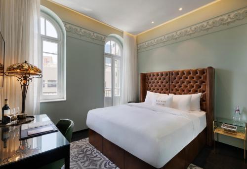 מיטה או מיטות בחדר ב-מלון בכר האוס