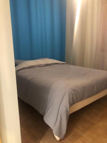 En eller flere senge i et værelse på Appartement calme à 5 min de St Jean de Maurienne