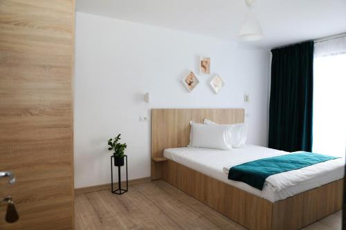 Postel nebo postele na pokoji v ubytování Hotel Dunavis