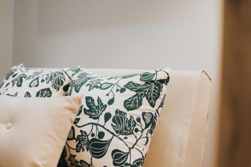 a pillow sitting on top of a bed with a pillow at Apartamentos MK77 León - Palomera in León
