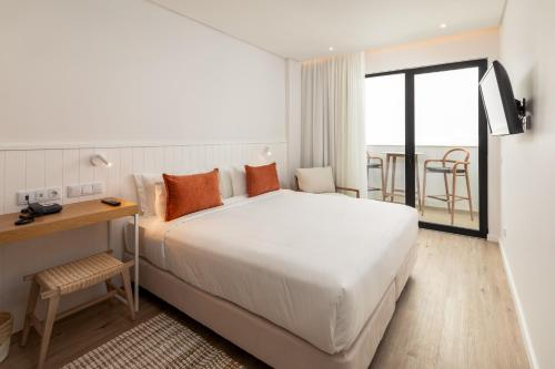 Pure Formosa Concept Hotel tesisinde bir odada yatak veya yataklar