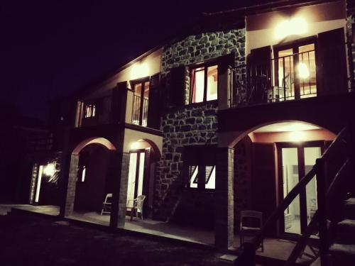 a building at night with its lights on at LissaHouse Agriturismo in San Pietro Vara