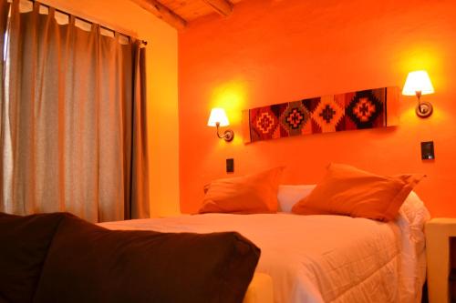 Tempat tidur dalam kamar di Cabañas Chacras del Arroyo Vidal