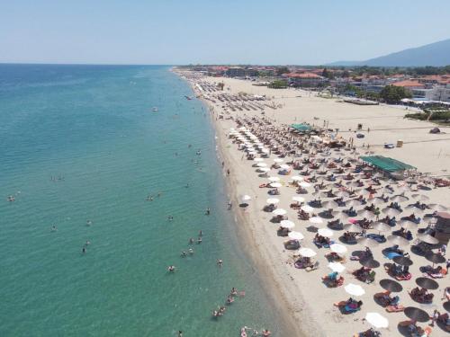 an overhead view of a beach with people in the water at Blue Horizon in Nei Poroi