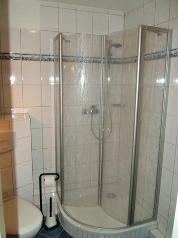 a bathroom with a shower and a toilet at Seesternchen in Am Schwarzen Busch