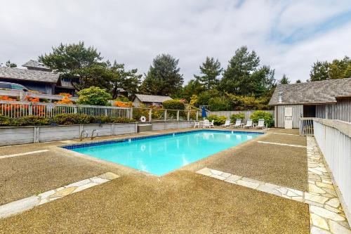 a swimming pool in the yard of a house at Searidge D2 in Depoe Bay