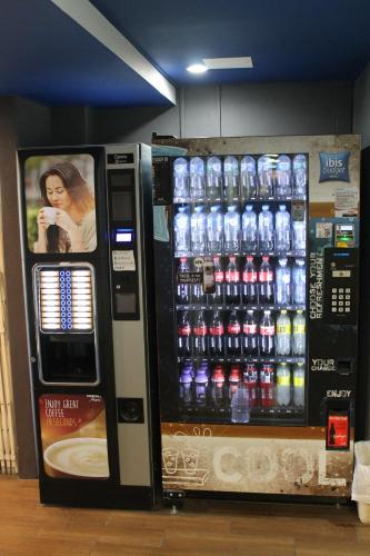 a vending machine filled with lots of bottles of water at ibis Budget - Melbourne Airport in Melbourne