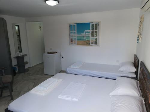 Ein Bett oder Betten in einem Zimmer der Unterkunft Casa George Mamaia Nord