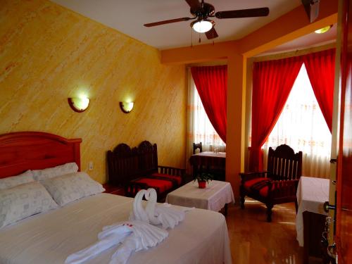 Ένα ή περισσότερα κρεβάτια σε δωμάτιο στο Hotel Pampa & Selva