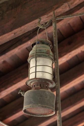 an old bell hanging from the ceiling of a building at Lu Garun Rus in Valdieri