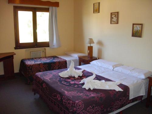 Ένα ή περισσότερα κρεβάτια σε δωμάτιο στο Hotel San Juan