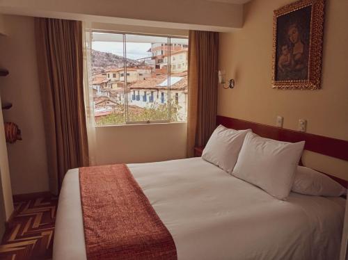 Awki´s Dream Hotel tesisinde bir odada yatak veya yataklar